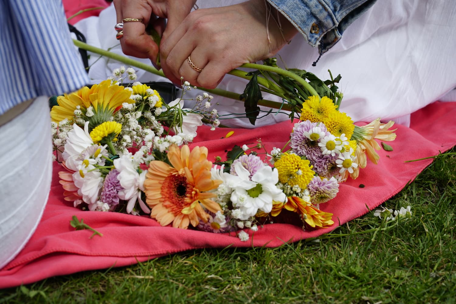 Close-up of flower crowns laid on a cloth